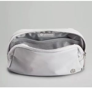 Gray lululemon belt bag with words